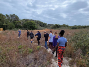 Students hike along a coastal trail as part of an ocean acidification literacy program. Provided by Flour Bluff Oceans Program (2023)